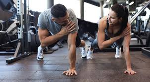 Toning Bingo Wings: Your Ultimate Guide to Sculpting Sleek Arms at the Gym 3 Fitness trainer demonstrating arm toning exercises Knutsford