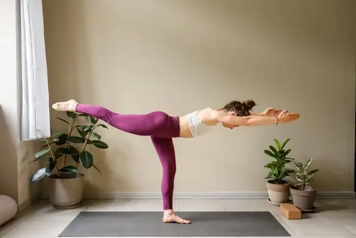 Woman doing Yoga exercise Knutsford to help with toning the body. 