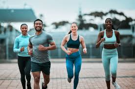 Sculpting Sleek Arms: The Essential Role of Cardio in Toning Without Bulking Up 3 image of people running to incorporate cardio Knutsford exercise into their life to help tone arms and body.